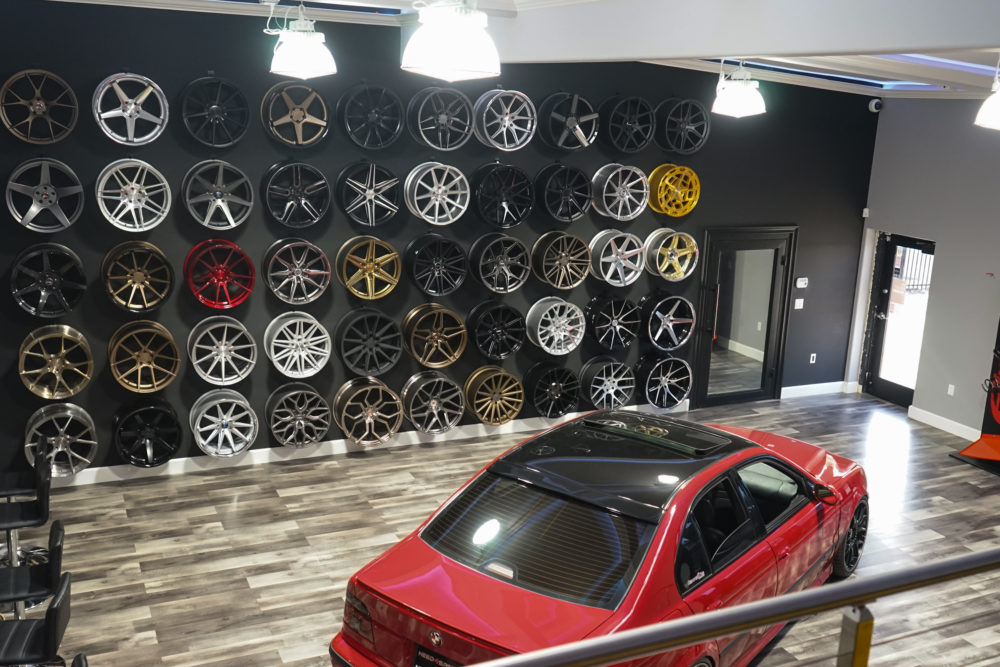 n4sm need 4 speed motorsports showroom top level view of wheel wall from back